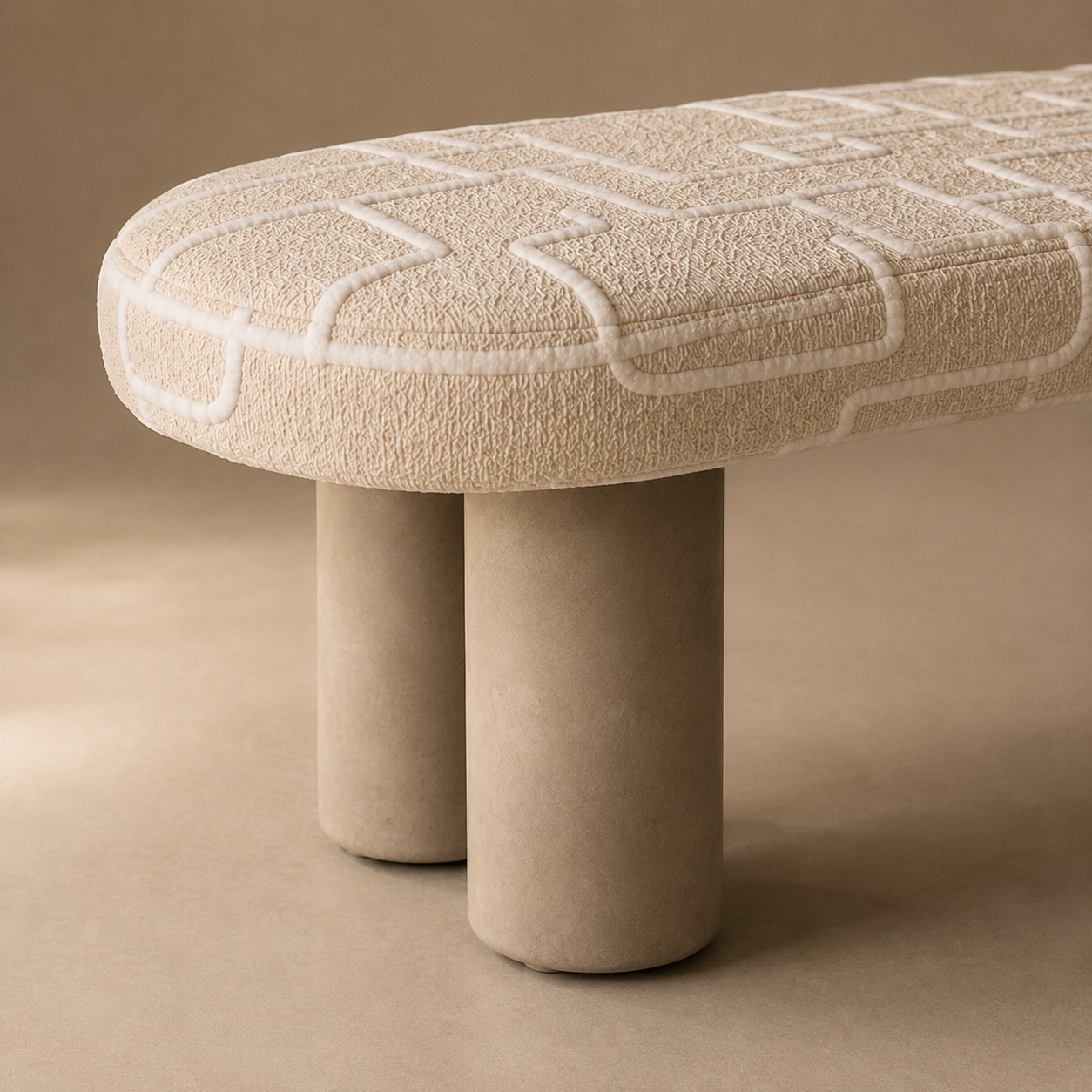 Detail of the sculptural cylindrical base and signature upholstery pattern.