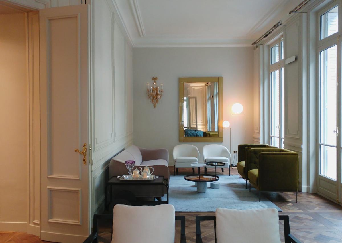 Living room with tall French windows and original boiseries, Duplex on Boulevard Saint-Germain, Paris