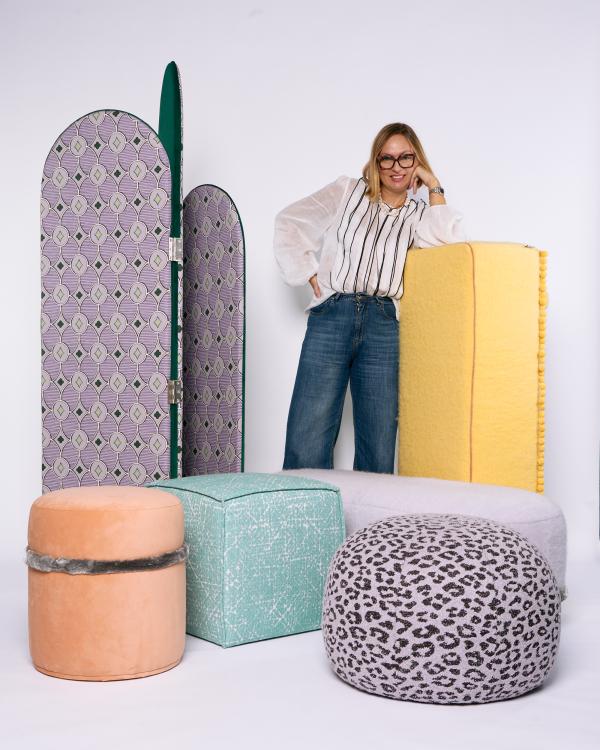 Marianna Piccolo among folding screens and poufs from the Marianna Piccolo Collection