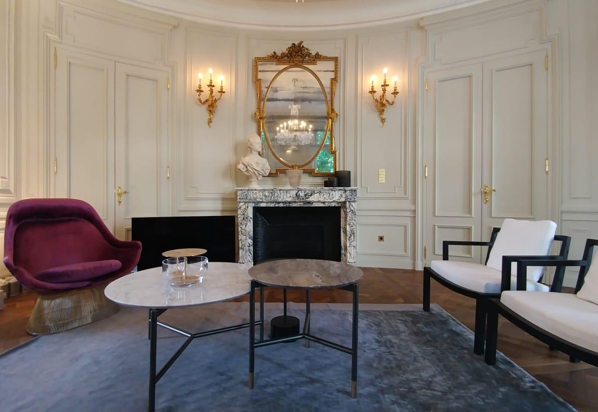 Living room with a marble fireplace and period boiseries, Duplex on Boulevard Saint-Germain, Paris