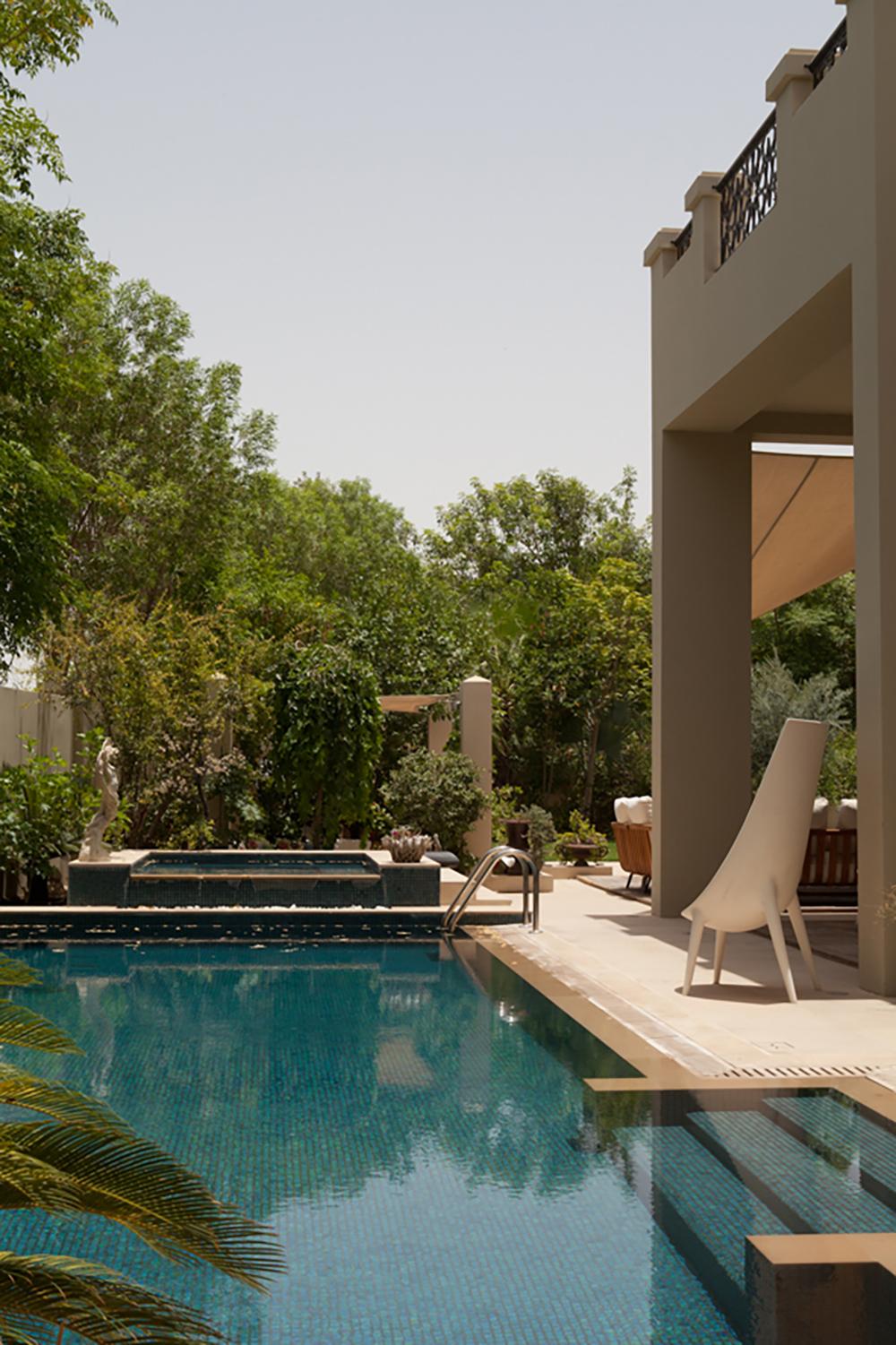 Poolside terrace with a covered cabana and palm trees, Al Barari Villa, Al Barari, Dubai