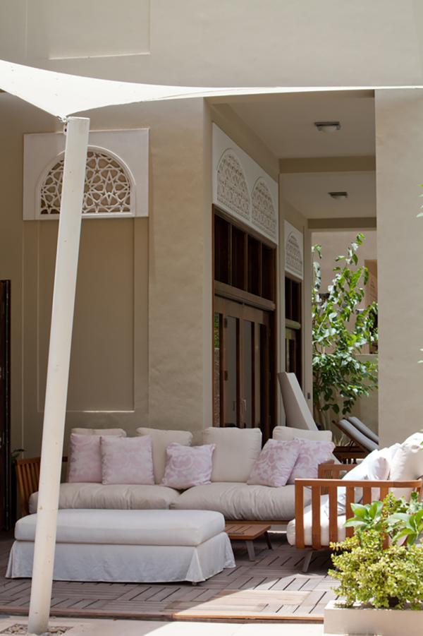 Covered outdoor lounge with sheer white curtains and a sofa, Al Barari Villa, Al Barari, Dubai