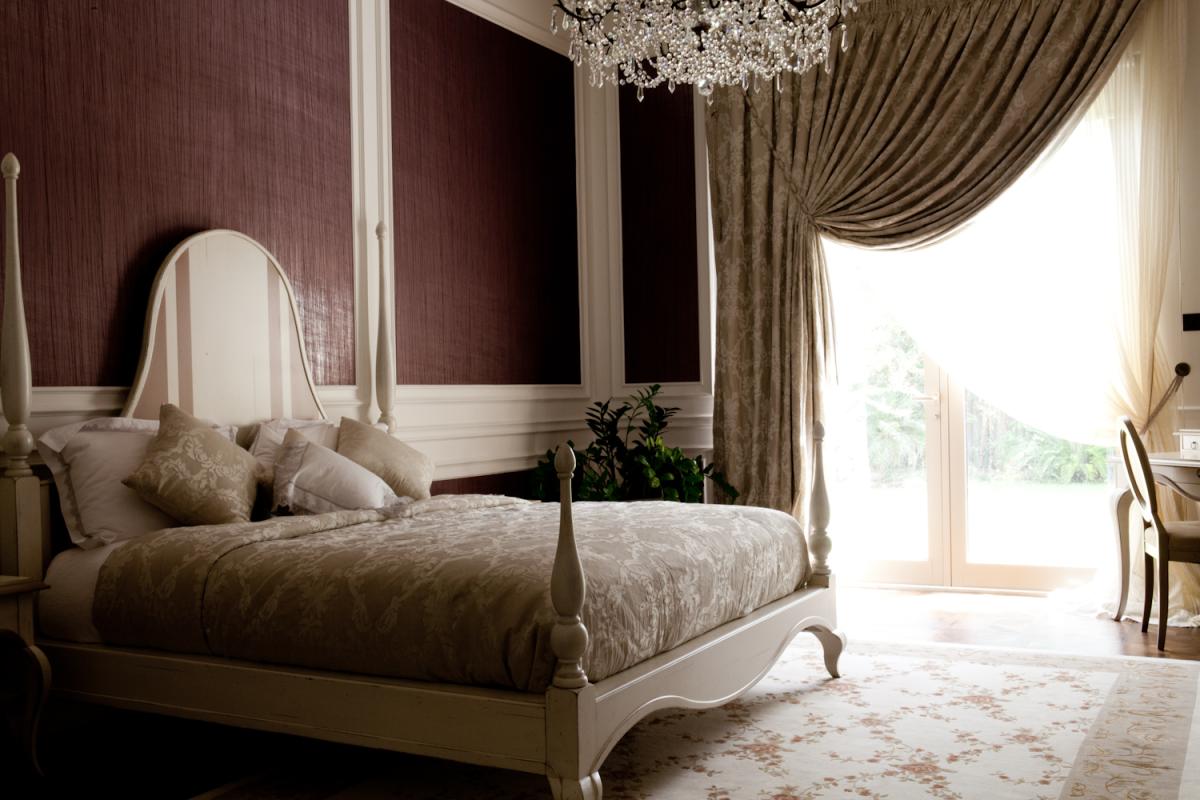 Bedroom with a white four-poster bed and a plum accent wall, Al Barari Villa, Al Barari, Dubai