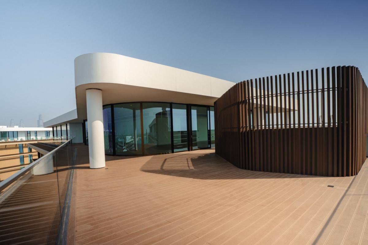 Exterior terrace with a curved roof and a wood slat screen, Bulgari Penthouse Building, Bulgari Island, Dubai