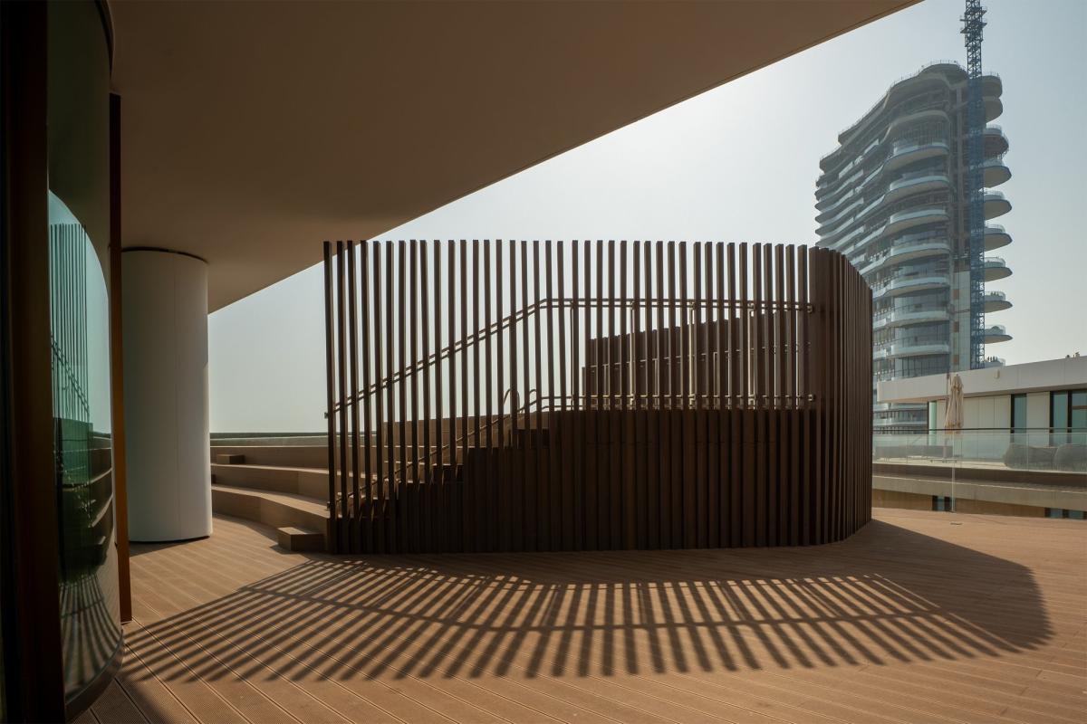 Exterior terrace staircase with a wood slat screen, Bulgari Penthouse Building, Bulgari Island, Dubai