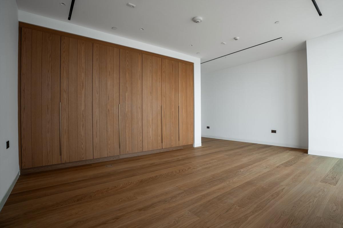 Empty room with a wood-panelled accent wall, Bulgari Penthouse Building, Bulgari Island, Dubai