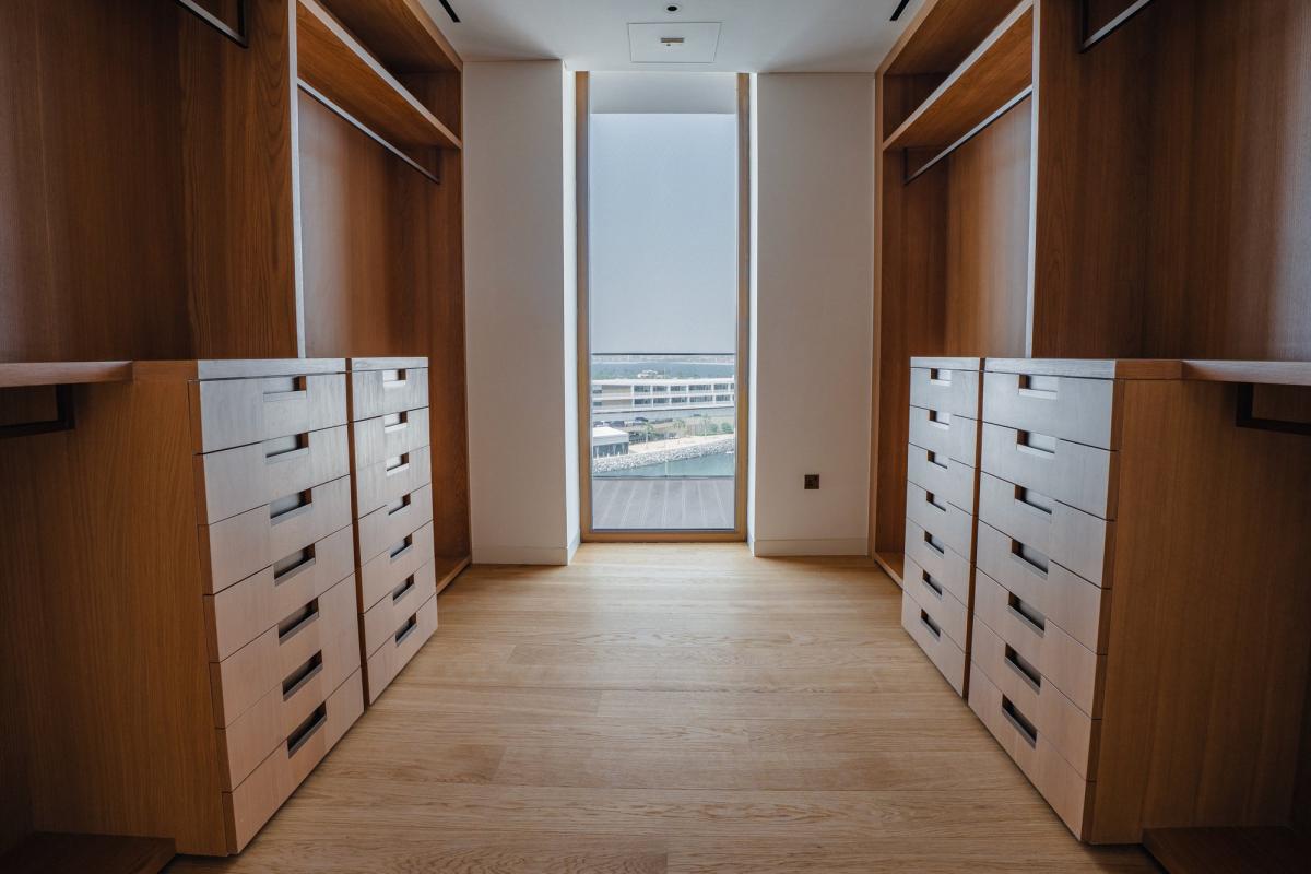 Walk-in wardrobe with open shelving and drawers, Bulgari Penthouse Building, Bulgari Island, Dubai