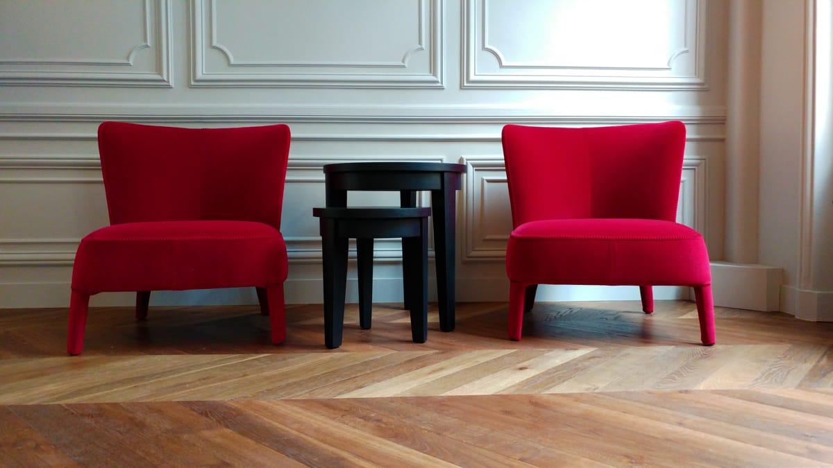 Red velvet armchairs on herringbone parquet flooring, Duplex on Boulevard Saint-Germain, Paris