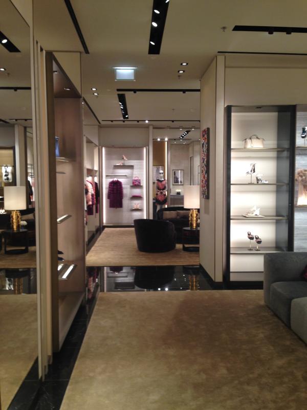 Boutique interior with glass display cases and mirrored surfaces