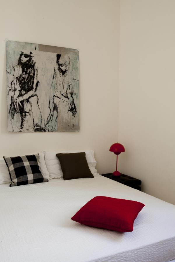 Bedroom with a white bed, a red table lamp, and black and white artwork, Historical Apartment in Puglia, Lecce, Puglia