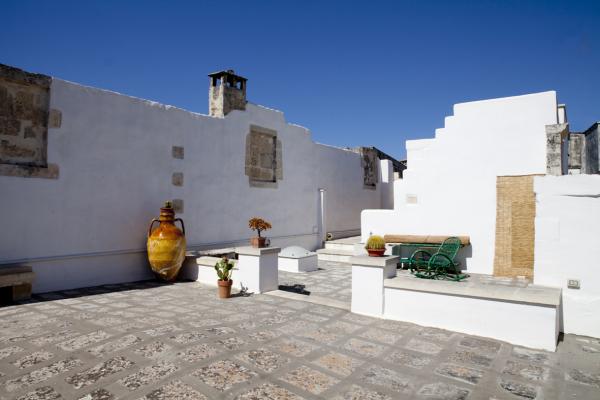 Rooftop terrace with whitewashed walls and terracotta jars, Historical Apartment in Puglia, Lecce, Puglia