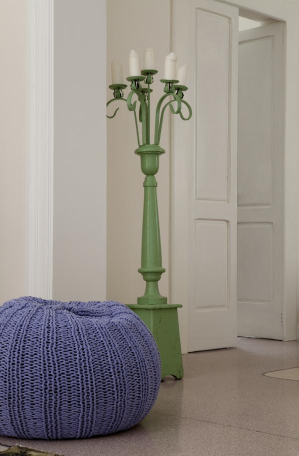 Bedroom detail with an ornate green bedpost and a lavender throw, Historical Apartment in Puglia, Lecce, Puglia