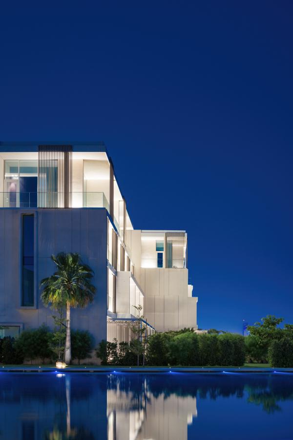Hotel building exterior against a blue sky, Oberoi Resort, Ajman