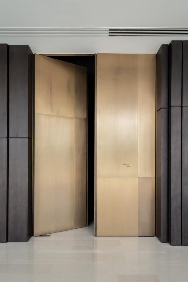 Bronze-paneled entrance doors, architectural detail, Oberoi Resort, Ajman