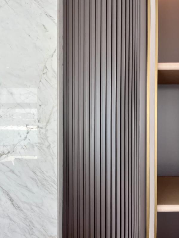 Detail of a fluted wood wardrobe door and a marble surround, One at Palm, Four Bedrooms, Palm Jumeirah, Dubai