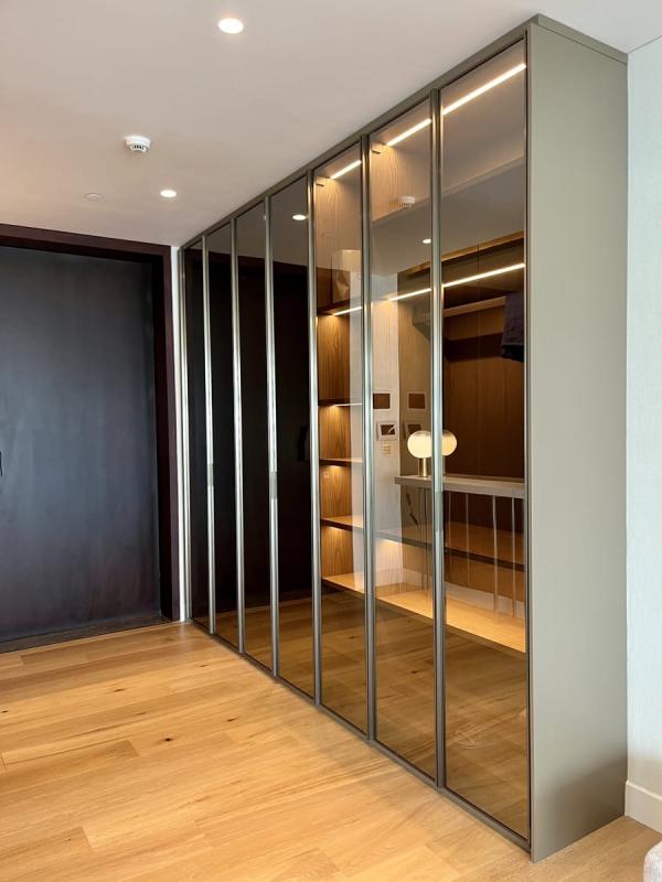 Walk-in wardrobe with mirrored sliding doors and wood flooring, One at Palm, Four Bedrooms, Palm Jumeirah, Dubai