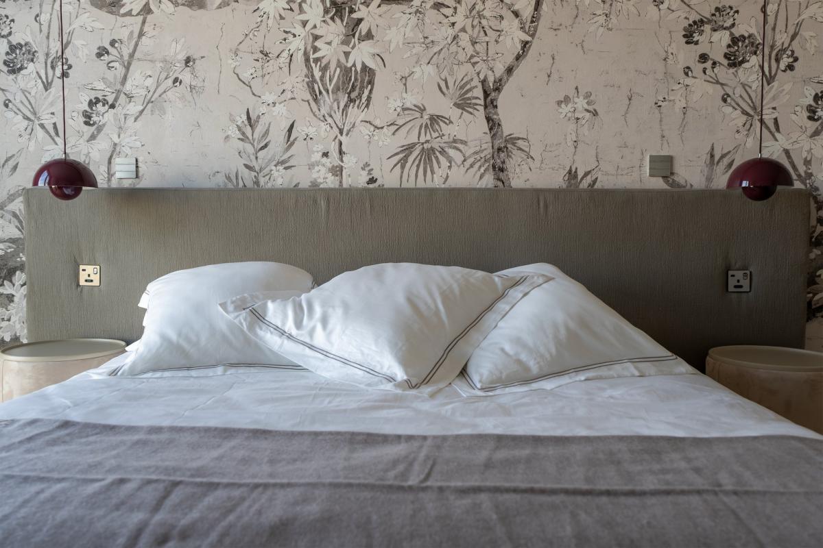 Bedroom with white bedding against a floral wallpaper wall, One at Palm, Three Bedrooms (Central Wing), Palm Jumeirah, Dubai