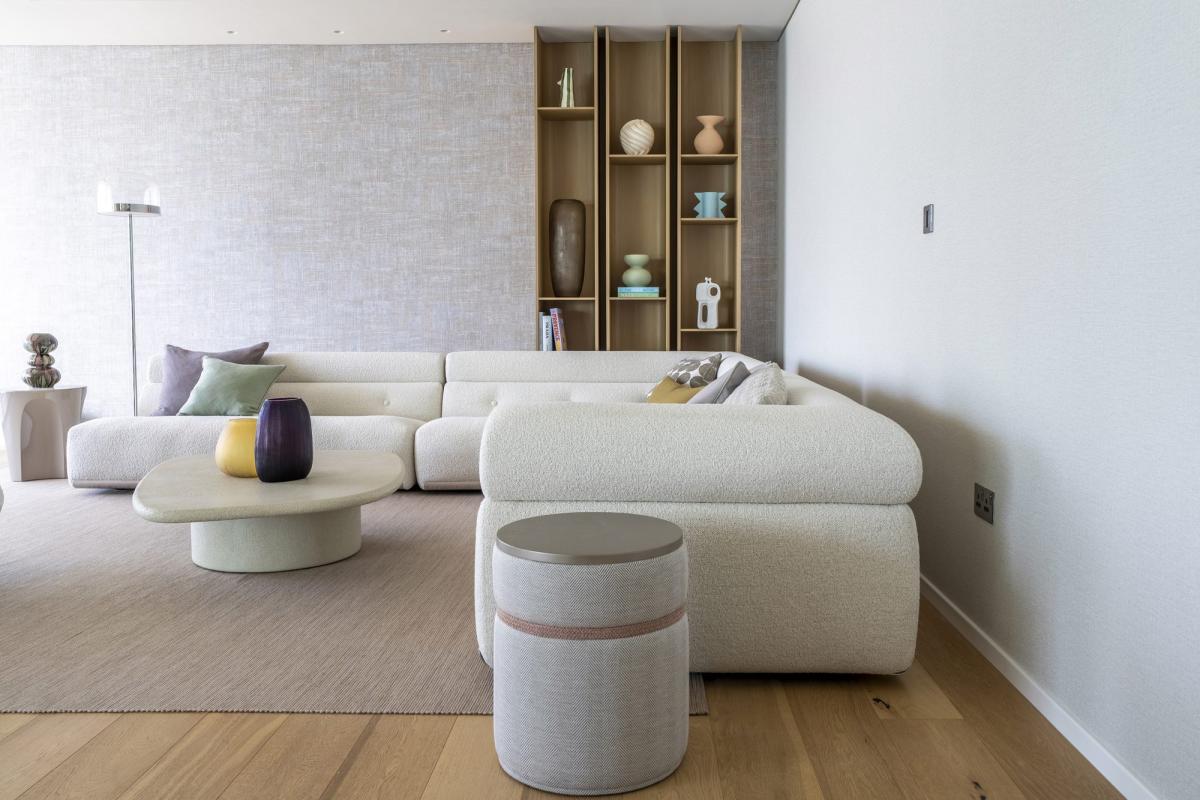 Living room with an L-shaped sofa, round side tables, and open shelving, One at Palm, Three Bedrooms (Central Wing), Palm Jumeirah, Dubai