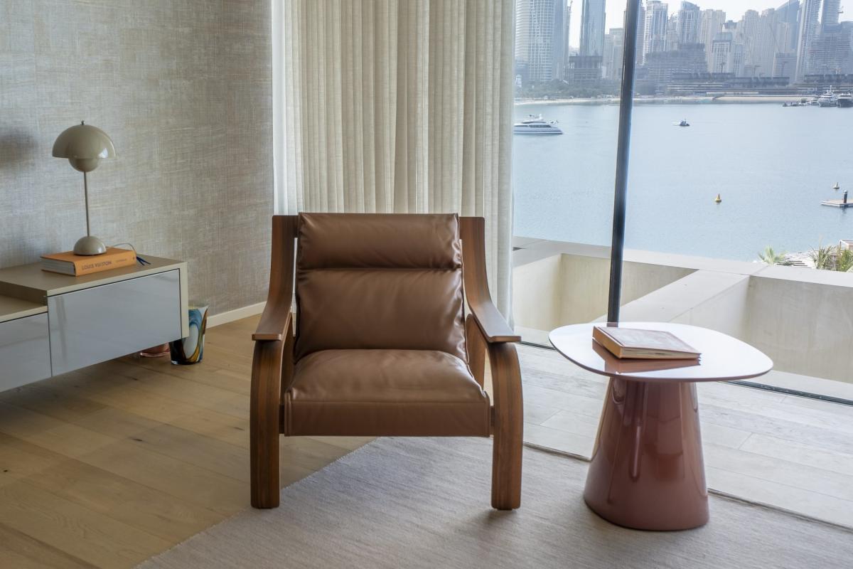 Sitting area with a tan leather armchair and a marble side table by the window, One at Palm, Three Bedrooms (Central Wing), Palm Jumeirah, Dubai