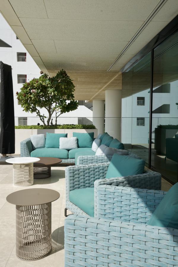 Terrace lounge with teal outdoor sofas, One at Palm Three Bedrooms, Palm Jumeirah