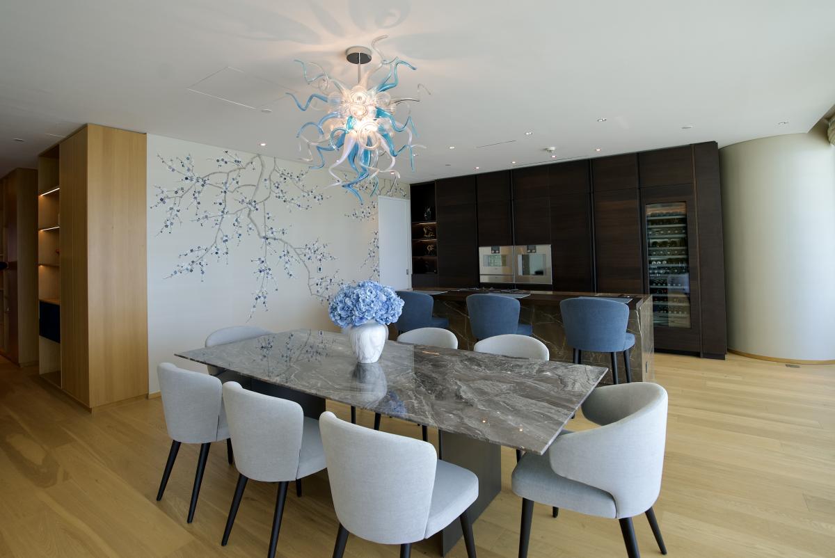 Dining room with a sculptural chandelier and marble table, One at Palm Three Bedrooms, Palm Jumeirah