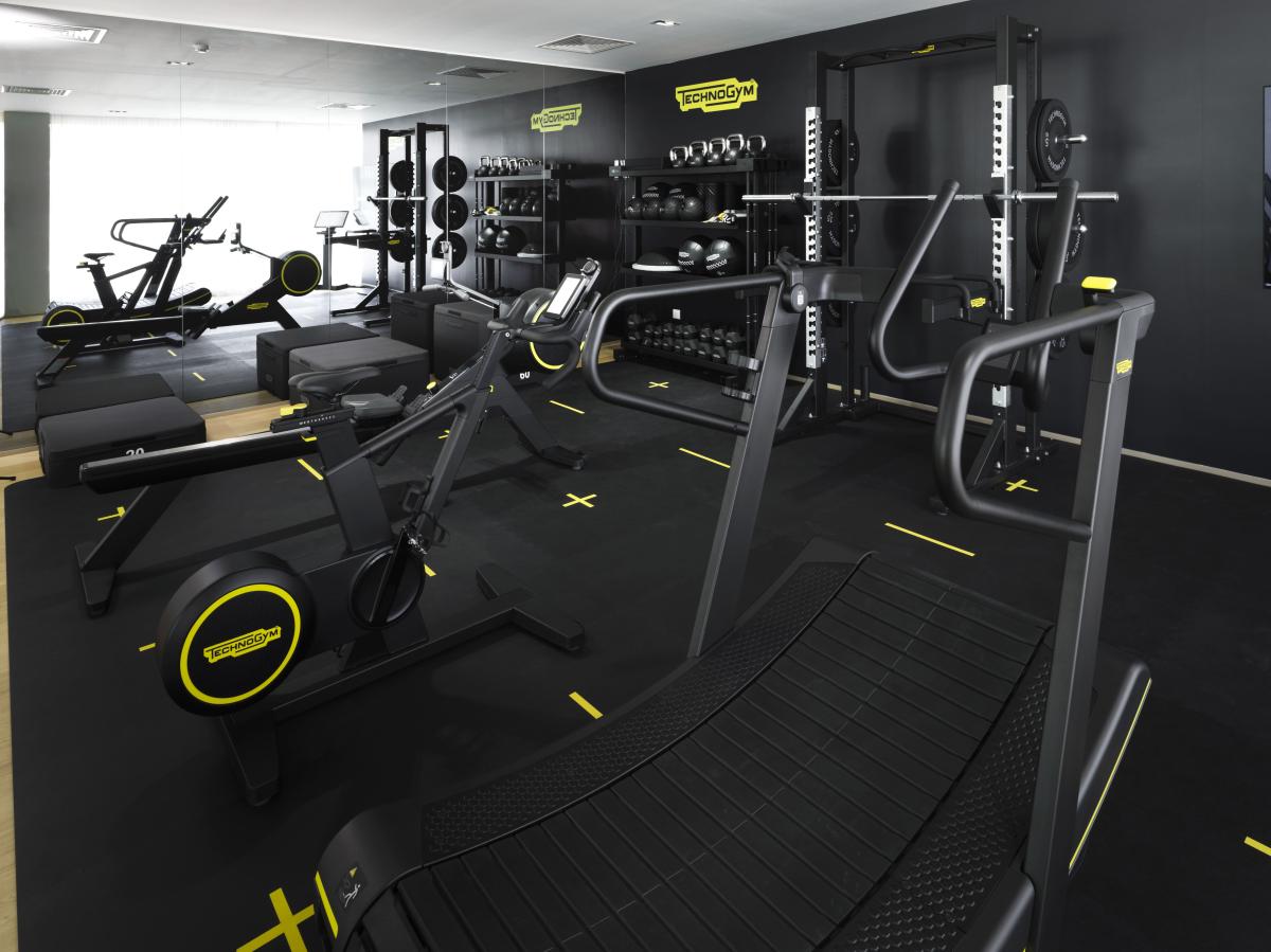 Gym floor with free weights and floor markings, Technogym Headquarters, Dubai