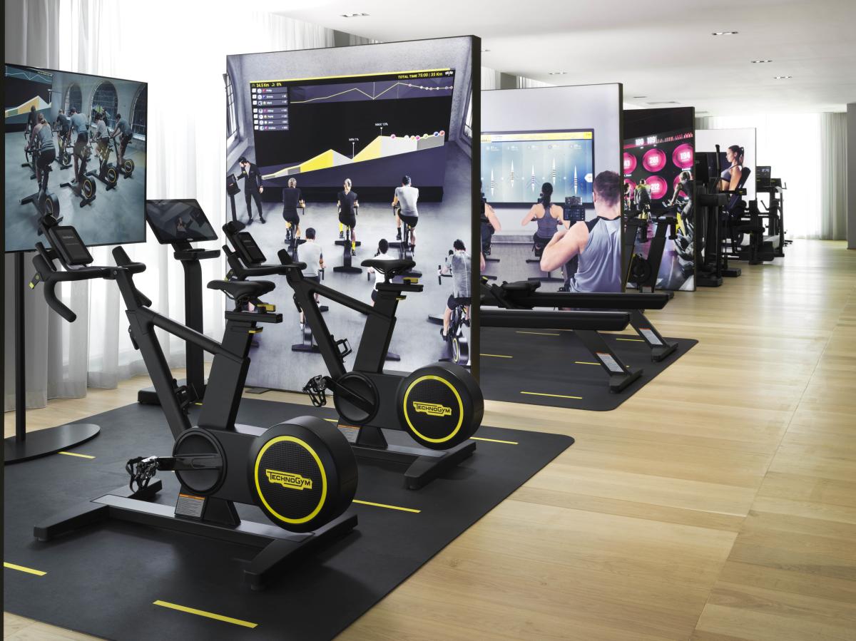 Showroom floor with exercise bikes and video displays, Technogym Headquarters, Dubai