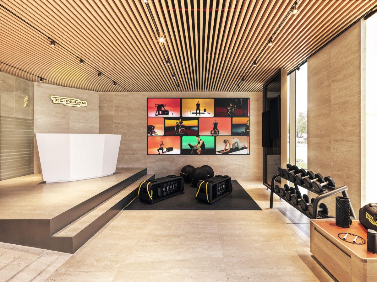 Showroom entrance with reception desk and product wall display, Technogym Headquarters, Dubai