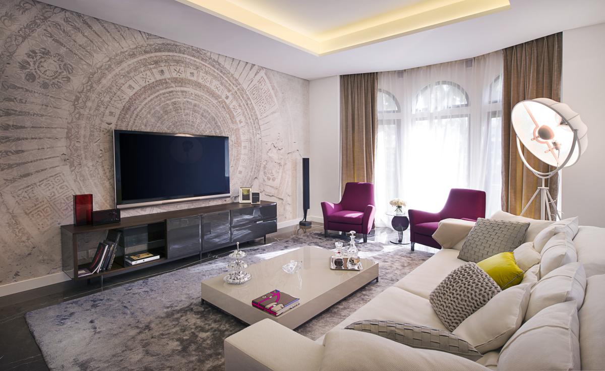 Living room with television console and sectional sofa, Villa Canal Cove, Palm Jumeirah
