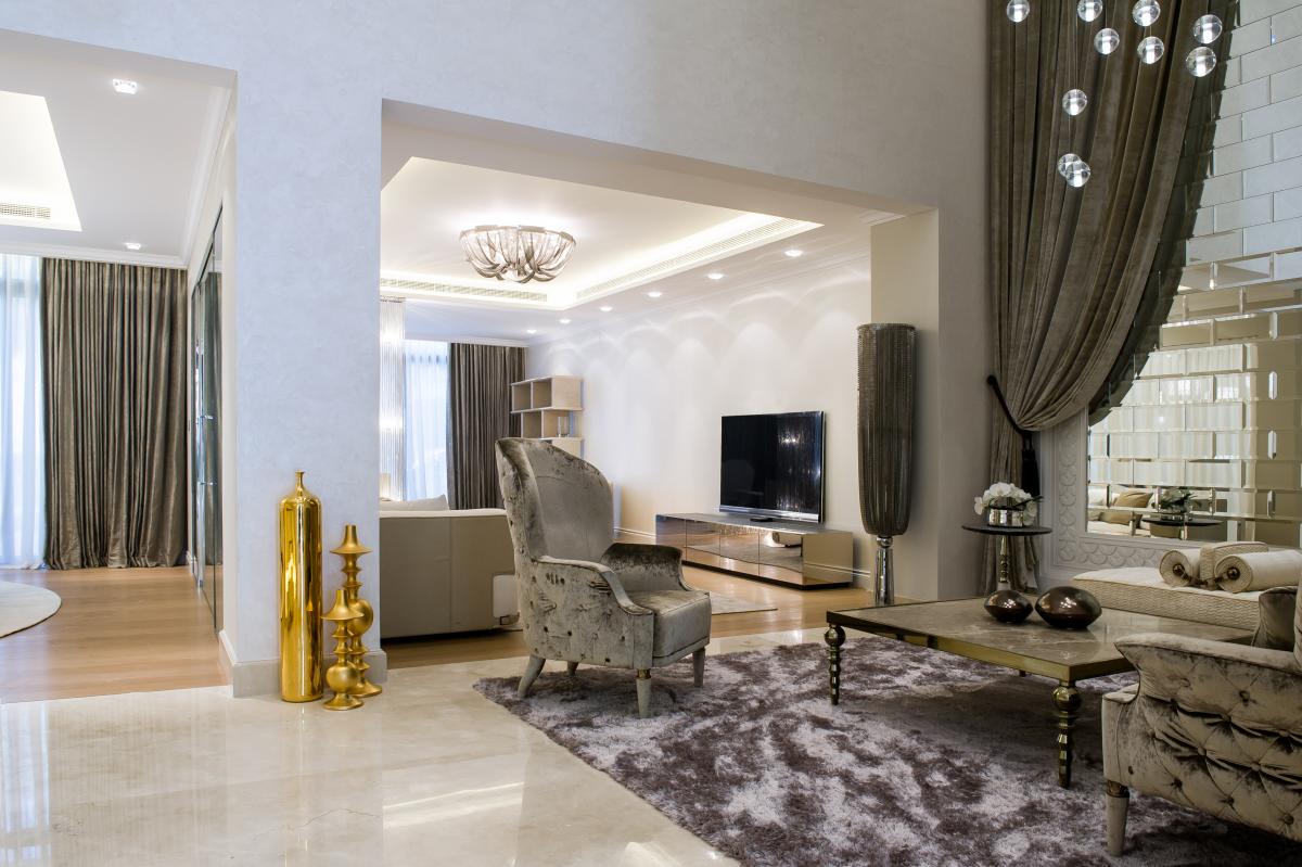 Living room with tufted armchairs, mirrored panels, and a beaded pendant light, Zabeel Saray Resort Villa, Palm Jumeirah, Dubai