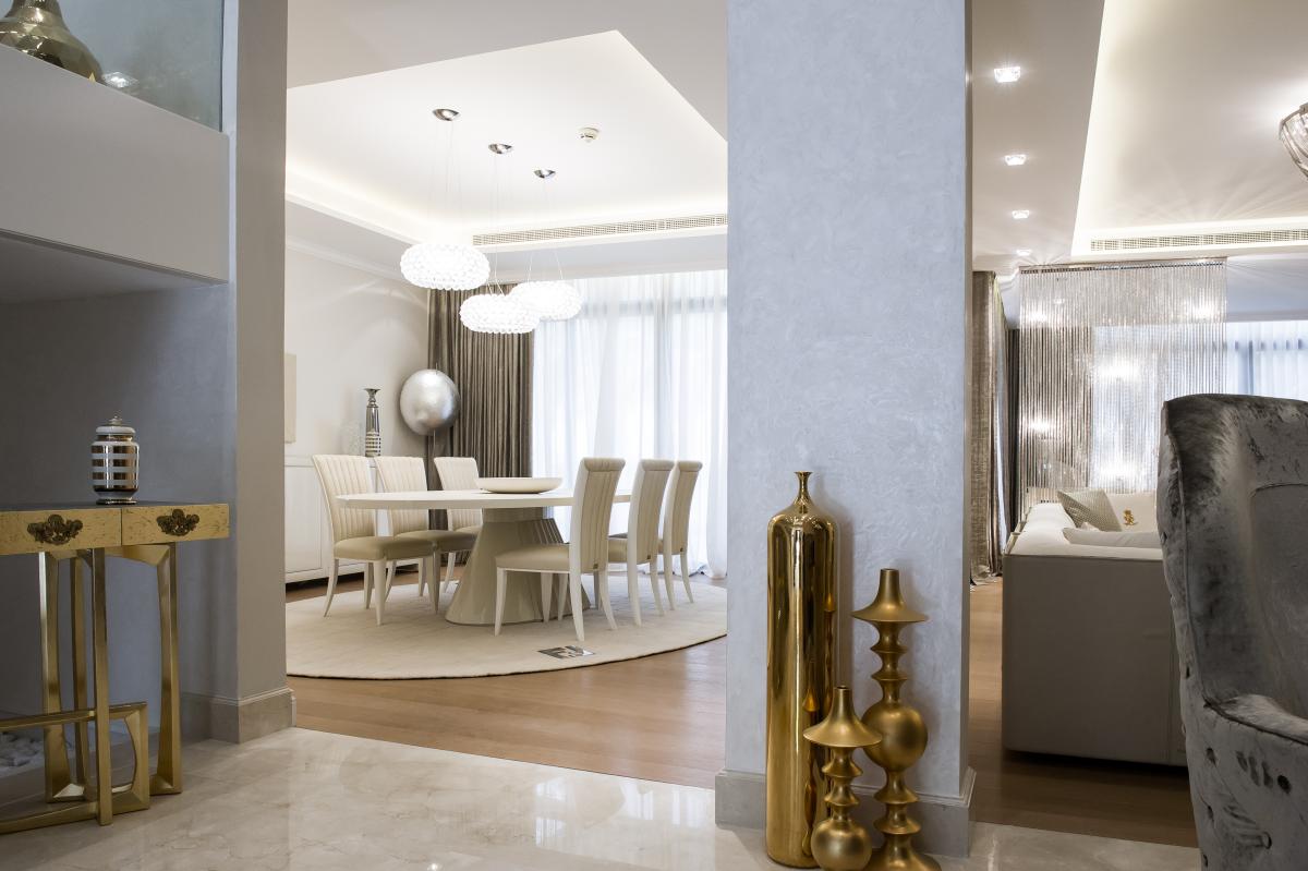 Dining room with a mirrored console, gold candle holders, and a crystal chandelier, Zabeel Saray Resort Villa, Palm Jumeirah, Dubai